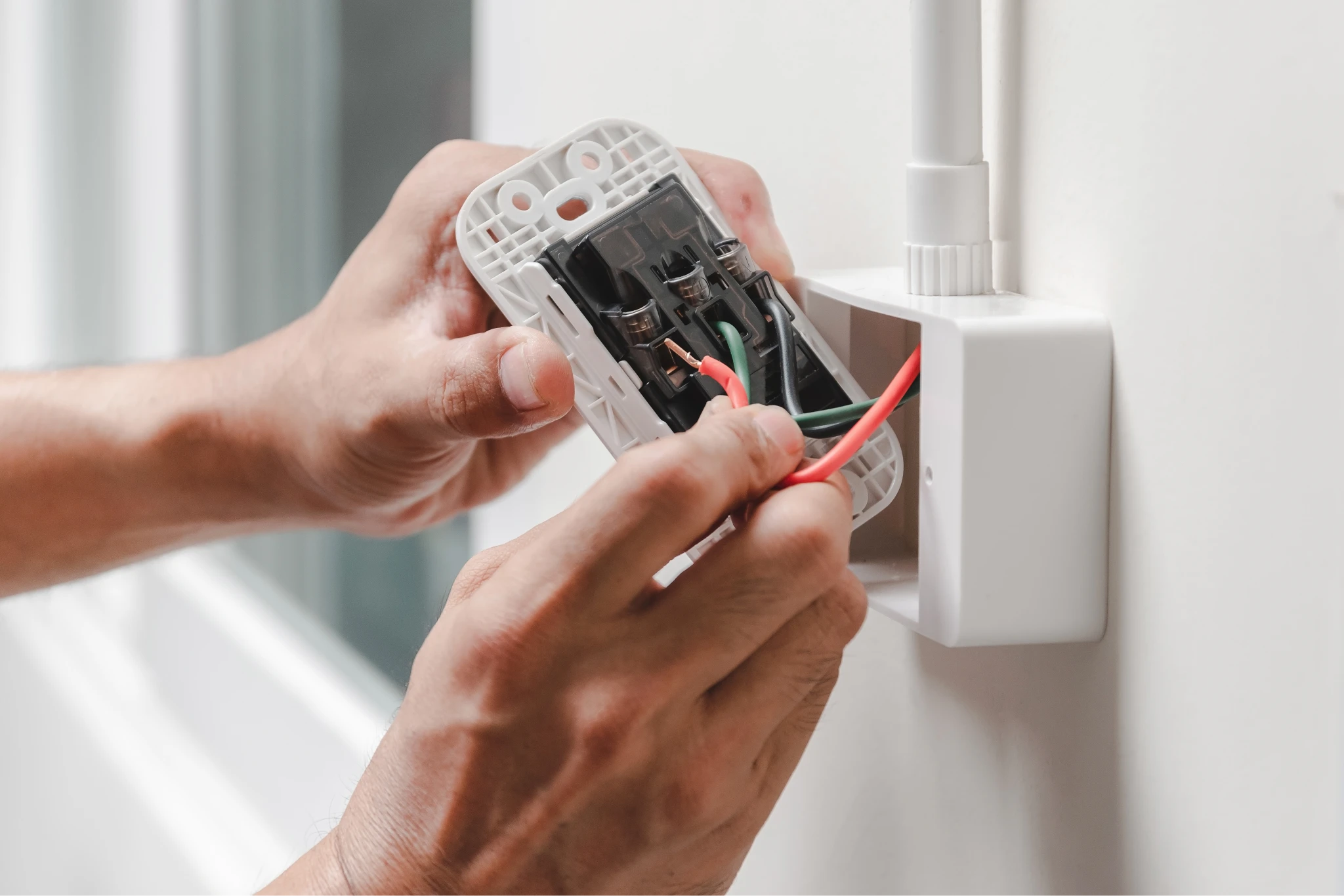 electrician installs electrical outlet free photo 1